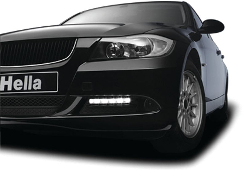 Crystal clear daytime running light with mounting hardware from Hella part number 010043801