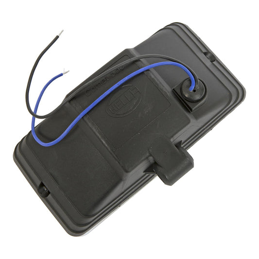 White fog light with mounting hardware from Hella part number 005700681