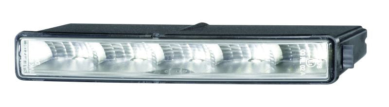 Crystal clear daytime running light with mounting hardware from Hella part number 010043801