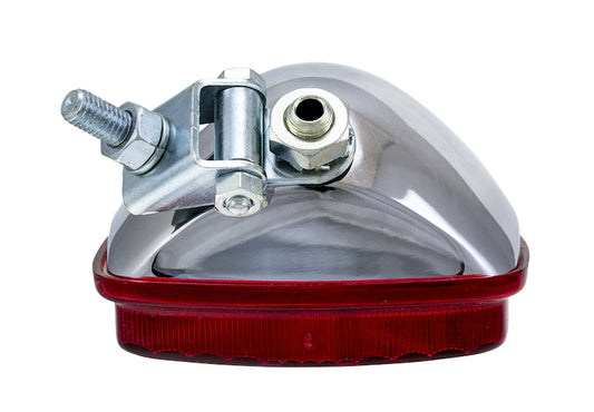 Chrome fog light with mounting hardware from Hella part number 003030151
