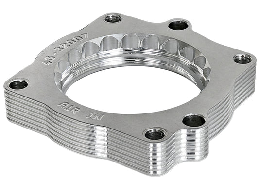 Raw natural 6061-t6 aluminum fuel injection throttle body spacer with mounting hardware from aFe Power part number 46-32007