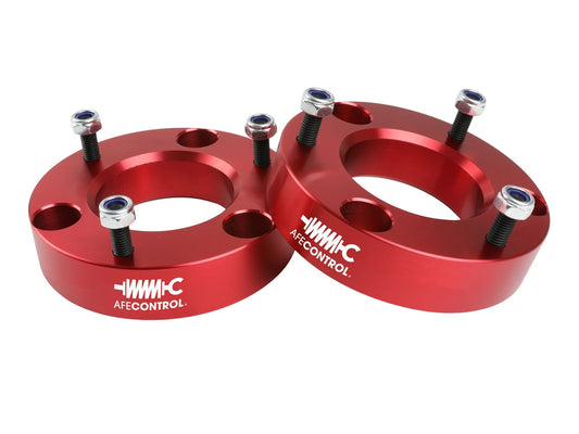 Red anodized 6061 aluminum suspension leveling kit from aFe Power part number 416-30T001-R