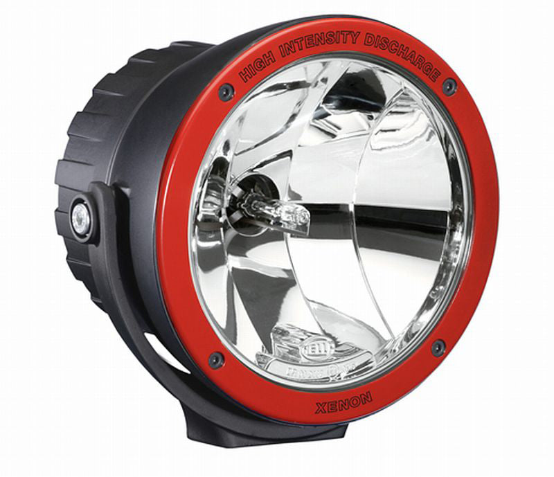 Black driving light with mounting hardware from Hella part number 009094331