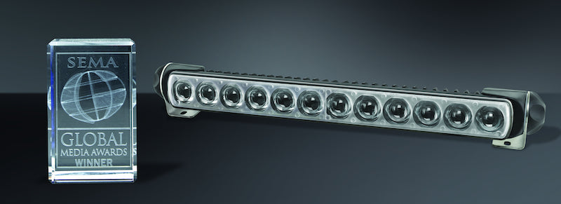 Black plastic light bar with mounting hardware from Hella part number 958040521