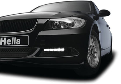 Crystal clear daytime running light with mounting hardware from Hella part number 010043801