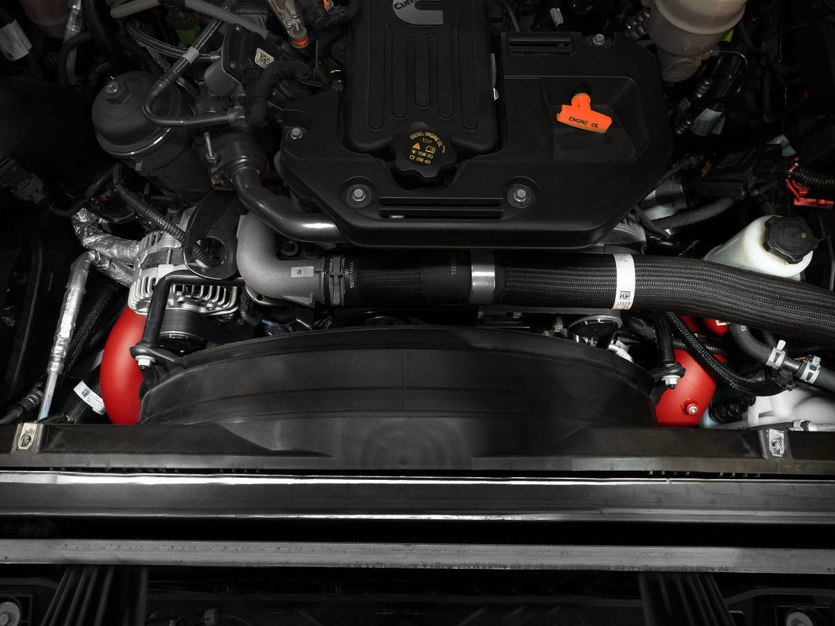 Red powdercoated aluminium intercooler pipe with mounting hardware from aFe Power part number 46-20814-R